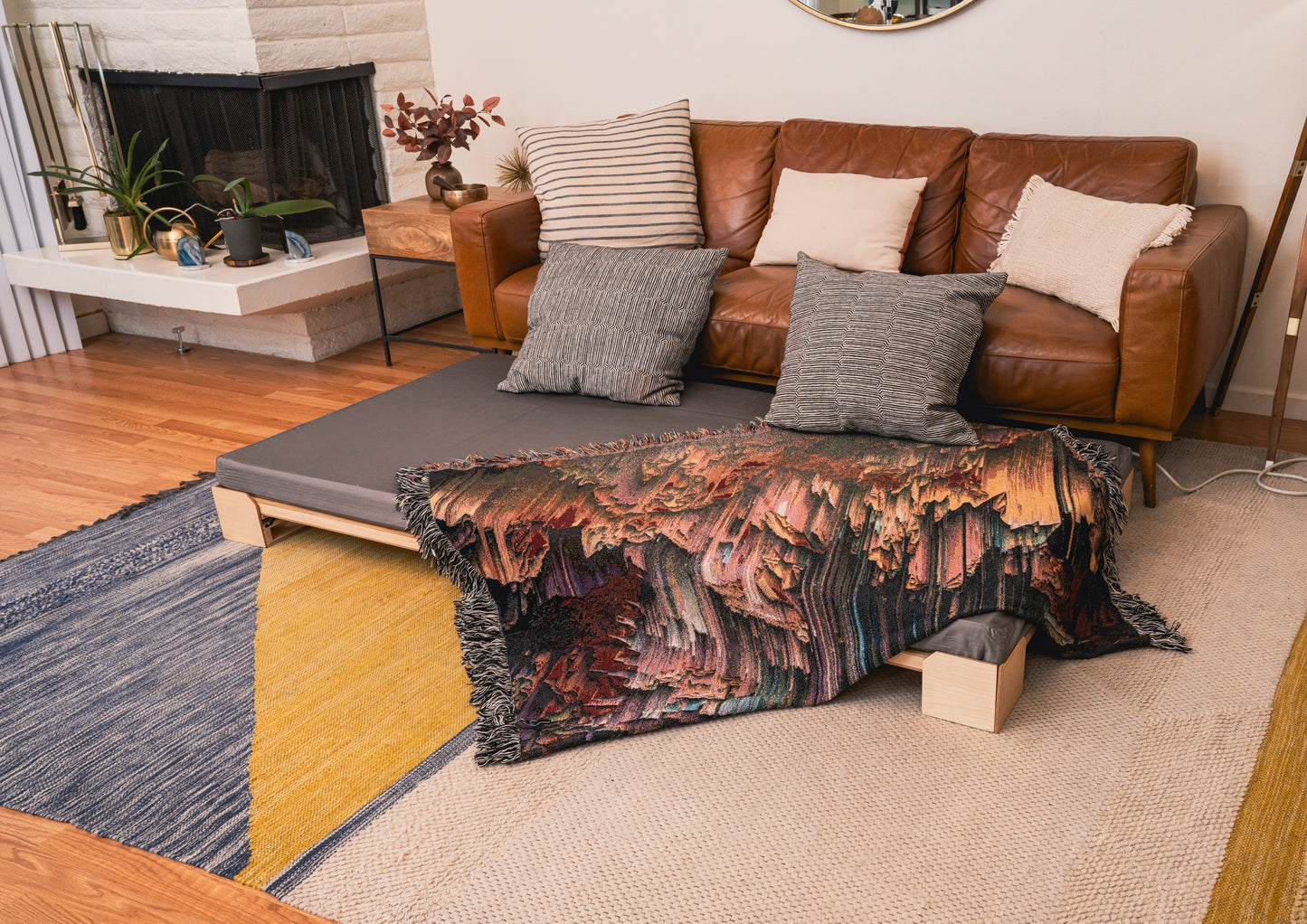A Crescendo Bass Bed placed in front of a couch in a living room.