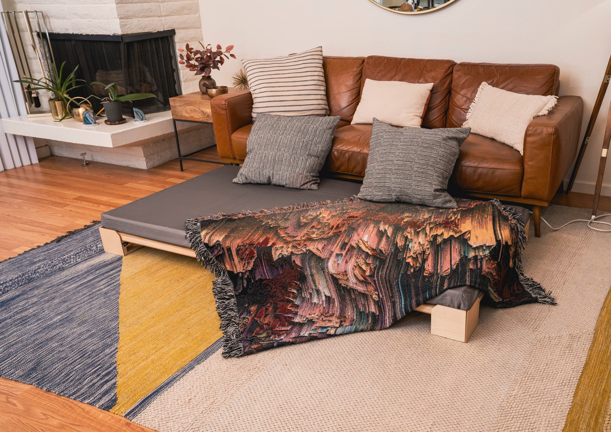 A Crescendo Bass Bed placed in front of a couch in a living room.