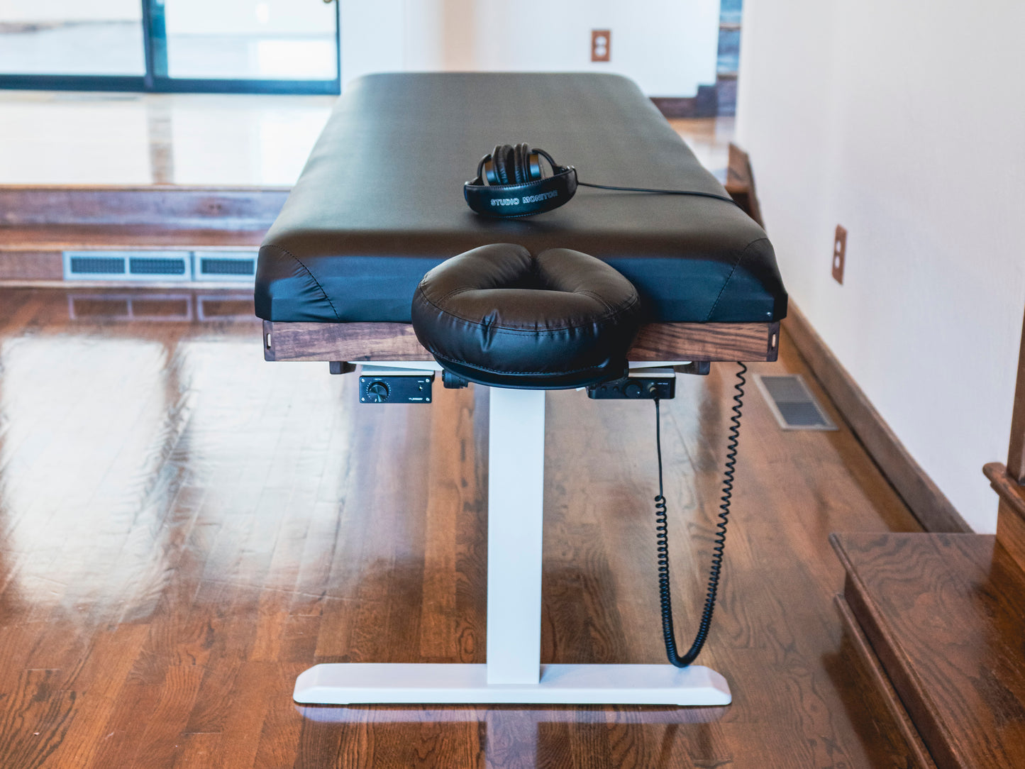 A Crescendo Massage Table with a view of the top headrest and electronics placement.